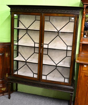 Lot 1375 - A carved mahogany astragal glazed display cabinet