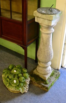 Lot 1381 - A weathered stone and composition sundial together with a weathered stone garden ornament