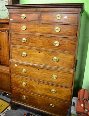 Lot 1385 - A George III mahogany tallboy, moulded cornice above two short and six long drawers, oval brass...