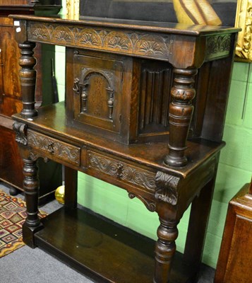 Lot 1386 - An oak court cupboard