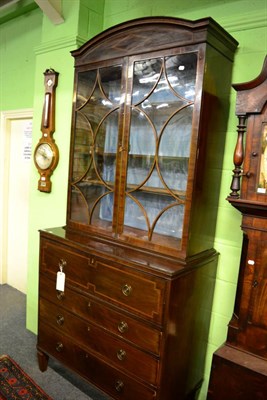 Lot 1387 - A Regency secretaire bookcase, the moulded and arched cornice above twin astragal glazed doors, the