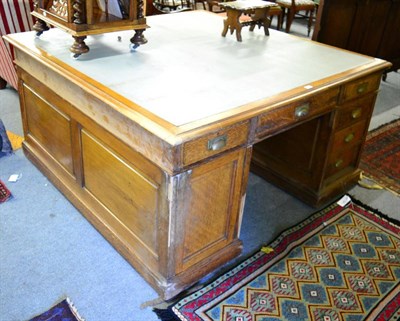 Lot 1390 - An early 20th century oak partners desk the drawer stamped 'Gillows'