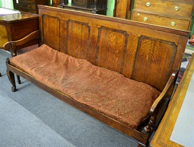 Lot 1392 - ^ A 19th century oak four panelled settle