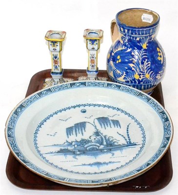 Lot 27 - A tin glazed earthenware Delft dish, pair of Faience candlesticks etc