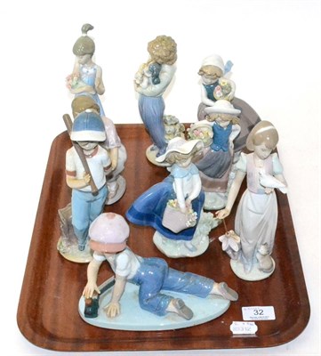 Lot 32 - Nine Lladro groups of children including a boy with train, a boy with puppy, a girl with teddy,...