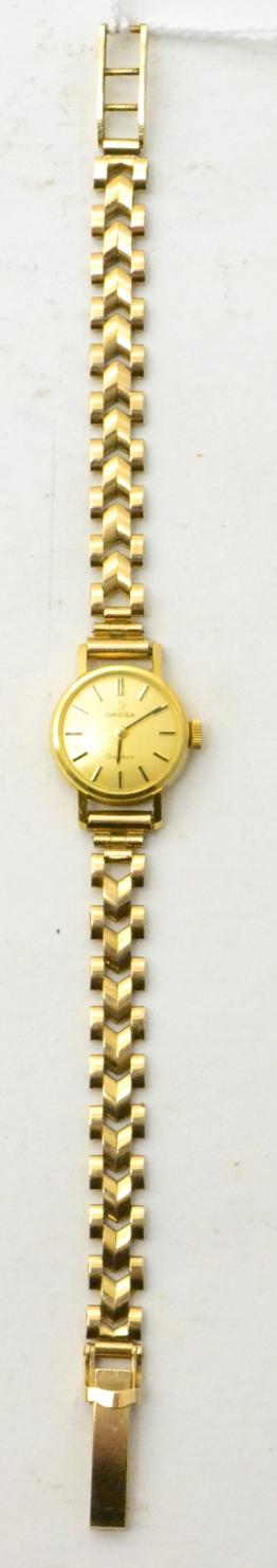 Lot 69 - A lady's 9ct gold Omega wristwatch, with box