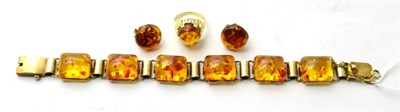 Lot 74 - A suite of amber jewellery, including a bracelet, a ring and pair of earrings, stamped '585'