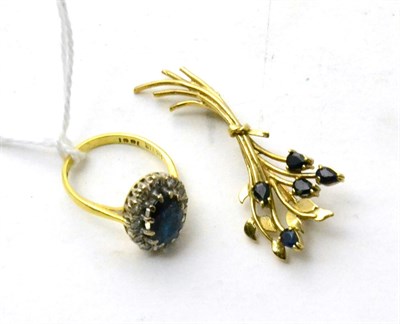 Lot 82 - An 18ct gold sapphire and diamond ring and a 9ct gold sapphire brooch (2)