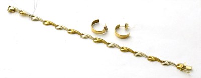 Lot 87 - A 9ct yellow and white gold bracelet and a pair of hoop earrings