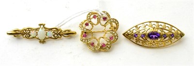 Lot 90 - A 9ct gold seed pearl and ruby brooch, a 9ct gold opal brooch and an amethyst brooch (3)