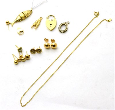 Lot 99 - A 9ct gold fish pendant, a charm, two 9ct gold padlock clasps, five pairs of earrings and a pendant