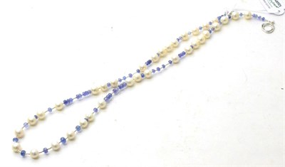 Lot 102 - A cultured pearl and tanzanite bead necklace, round cultured pearls spaced by groups of faceted...