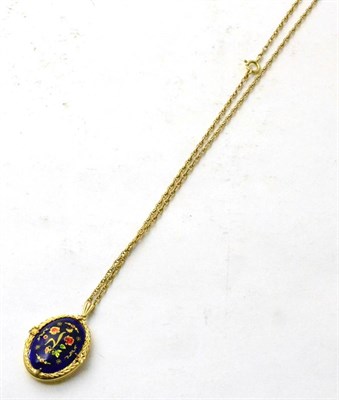 Lot 104 - A 9ct gold enamel locket on chain
