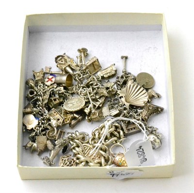 Lot 108 - Four various charm bracelets with silver and metal charms