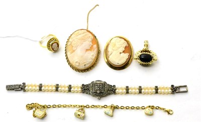 Lot 122 - Two cameo brooches, a cameo ring, a swivel fob, a cubic zirconia pendant, a 9ct gold charm bracelet