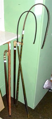 Lot 140 - Two Victorian coaching whips and three various walking sticks
