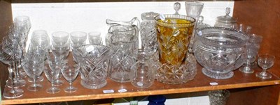 Lot 157 - A shelf of cut glass, drinking glasses, jugs, vases, decanters, etc