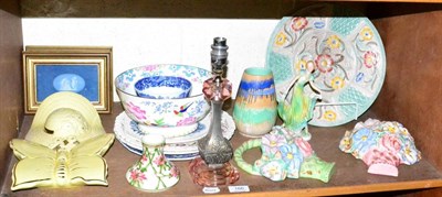 Lot 166 - A shelf of Art Deco and 20th century ceramics including wall pockets and a table lamp