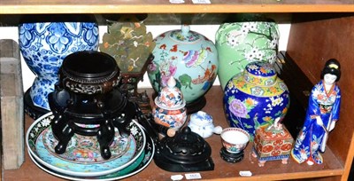 Lot 167 - A shelf of Oriental items including ginger jars and covers, vases, dishes, printing block, jade...