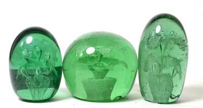 Lot 181 - Three Victorian green glass dumps with flower inclusions