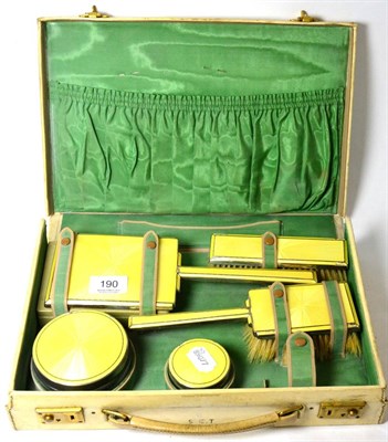 Lot 190 - Silver and yellow enamel travelling dressing table set, cased