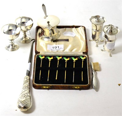 Lot 191 - A group of silver items, including a set of six cocktail sticks (cased) two miniature trophy...
