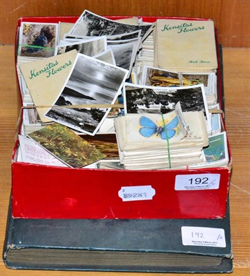 Lot 192 - An early 20th century album of postcards and a box of cigarette cards