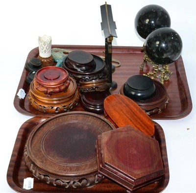 Lot 202 - A quantity of Chinese hardwood stands, a jade type pendant etc (two trays)
