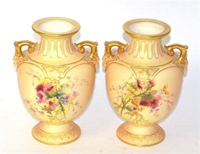 Lot 224 - A pair of Royal Worcester blush ivory twin handled vases model no 1632