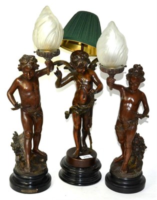 Lot 240 - A pair of spelter lamps one titled 'Hesitation' and a similar lamp