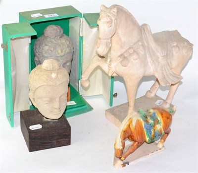 Lot 243 - Two composition Eastern heads and two Tang style horses