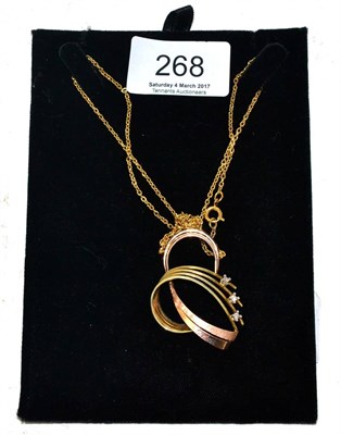 Lot 268 - A diamond set pendant stamped '585' on a fine chain