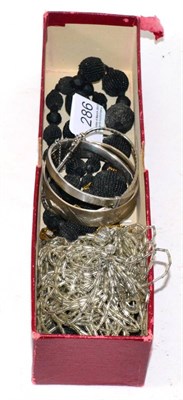 Lot 286 - Three silver bangles, two beaded necklaces and an opal necklace