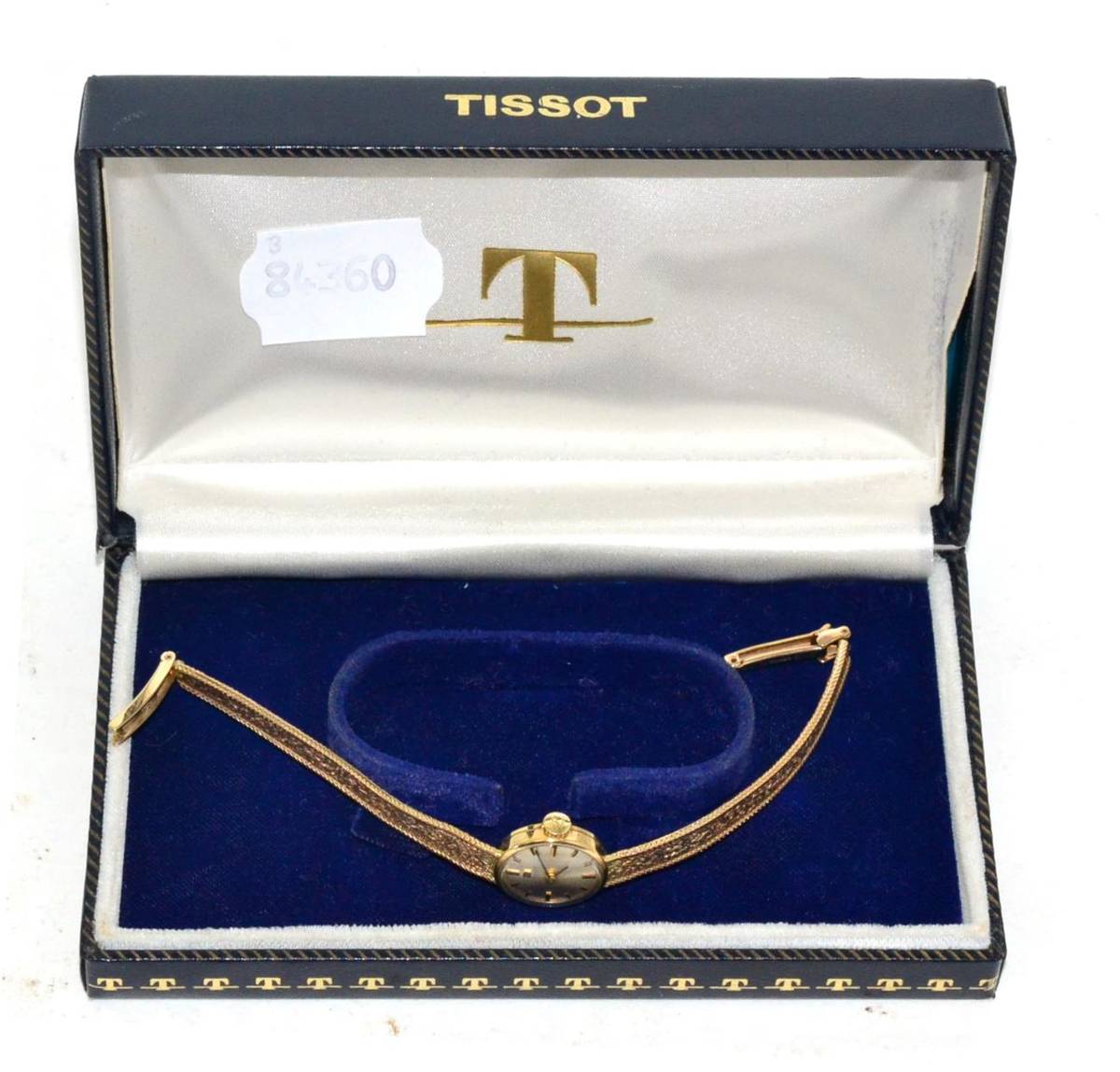 Lot 288 - A lady's 9ct gold wristwatch, signed Tissot, with a Tissot box