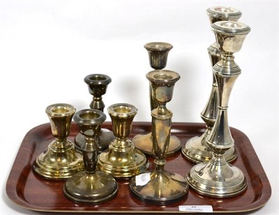 Lot 5 - Four pairs of filled silver candlesticks, the tallest 20.5cm
