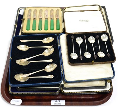 Lot 48 - A cased set of silver pistol handled butter knives with steel blades, another set of silver...