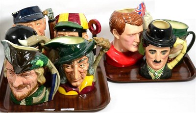 Lot 51 - A collection of Royal Doulton character jugs including Charlie Chaplin and Robin Hood (8)