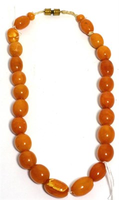 Lot 58 - An amber bead necklace, 42cm long