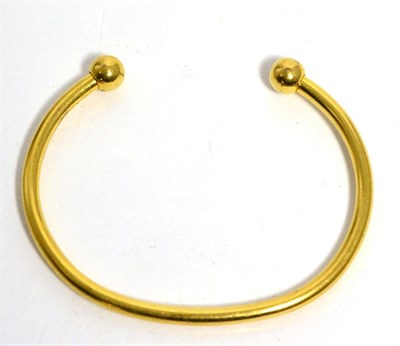 Lot 70 - A torque bangle