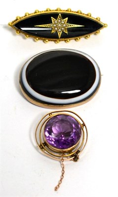 Lot 71 - A onyx and seed pearl brooch, an amethyst brooch and a sardonyx brooch (a.f.)