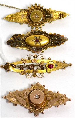 Lot 72 - A Victorian brooch stamped '15CT' and three Victorian 9ct gold brooches (4)