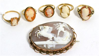 Lot 73 - A carved shell cameo depicting Peace halting the horses of Mars together with five cameo rings (6)