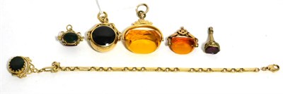 Lot 92 - A 9ct gold hardstone set swivel fob, two other hardstone set swivel fobs, a seal and two paste...