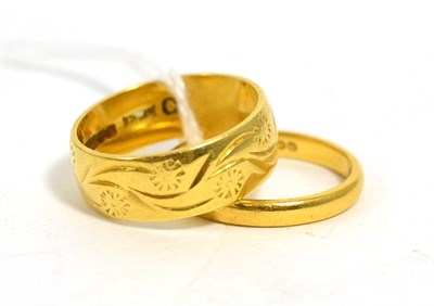 Lot 96 - An 18ct gold band ring and a 22ct gold band ring