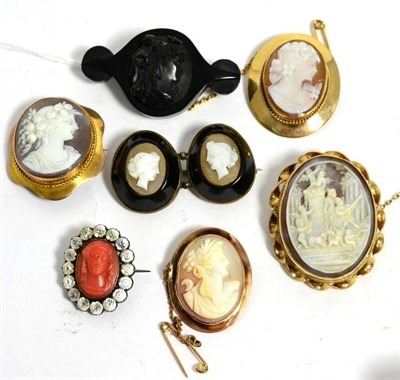 Lot 102 - A jet cameo brooch, a double carved shell cameo brooch in jet frame, a carved coral cameo in...