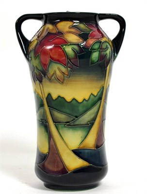 Lot 130 - Moorcroft pottery: a gold member twin-handled Waterton pattern vase by Sian Leeper, 19cm high...