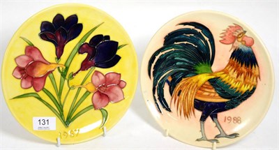 Lot 131 - Moorcroft pottery: two plates, Freesia 1987 year plate, no. 160/250, designed by Walter...