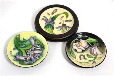 Lot 140 - Moorcroft pottery; three coasters, Day Dream by Sian Leeper, Toad Lily by Philip Gibson, Isis...