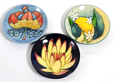 Lot 146 - Moorcroft pottery: a group of three coasters, May Lily MCC 2001 (Moorcroft Collectors Club)...