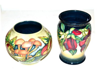 Lot 153 - Moorcroft pottery: a Pastimes pattern vase, limited edition 14/250, 11cm high; together with a...